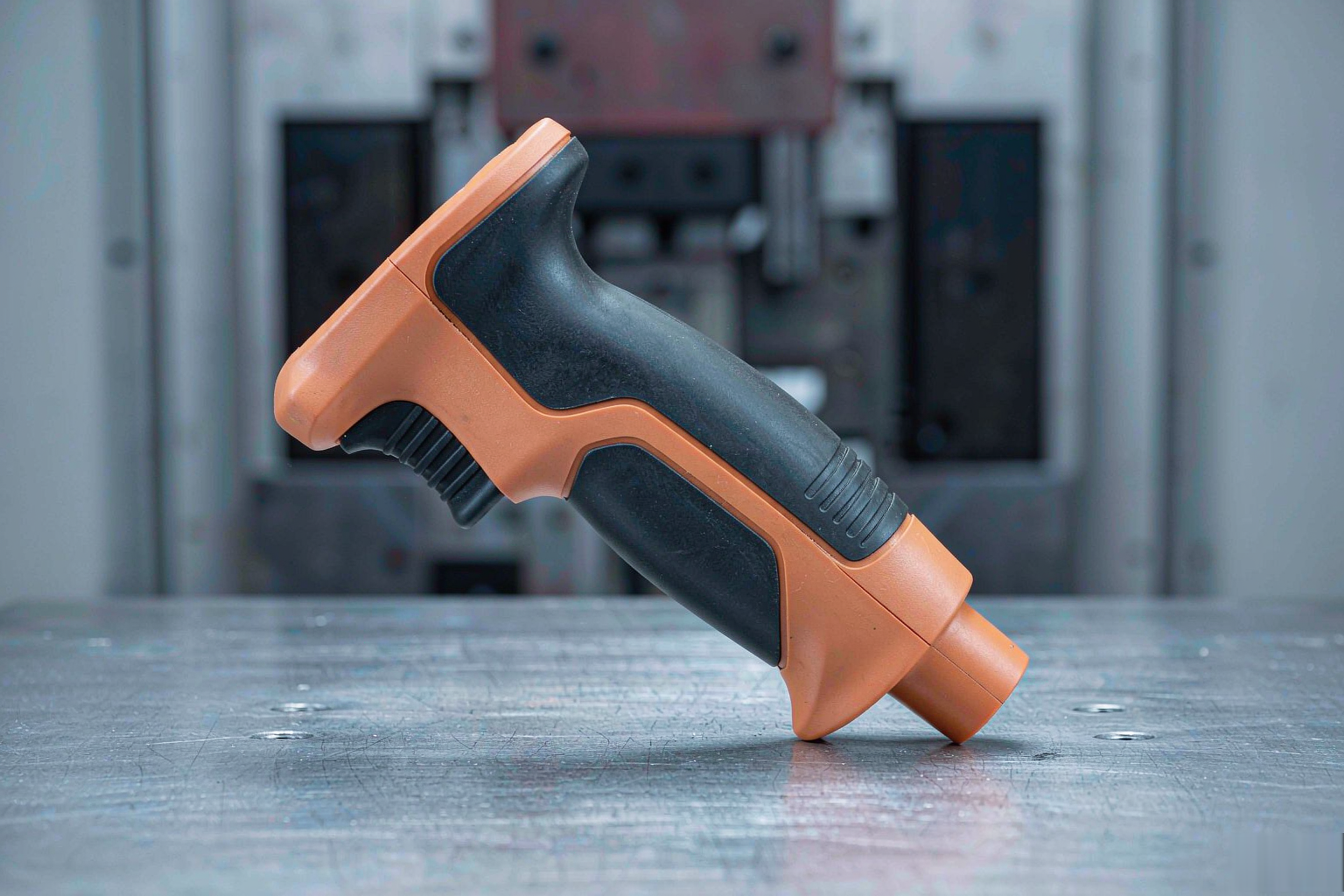 Overmolded power tool handle with rigid ABS body and soft TPE grip layer