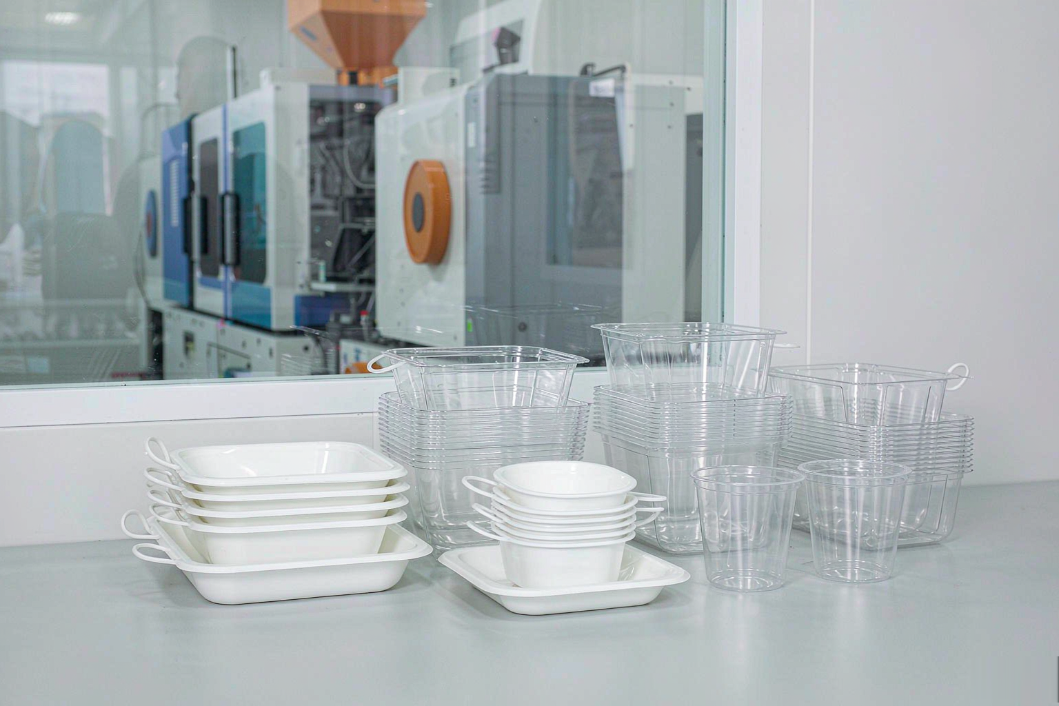 Thin-wall injection molded plastic containers and cups with uniform thin walls